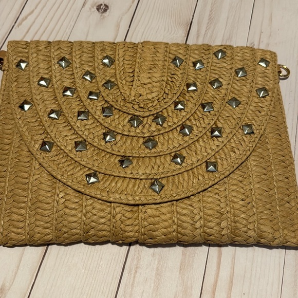 Tan clutch w silver grommets